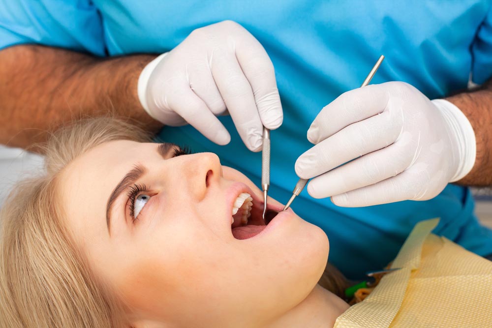 Surgical extraction of impacted or problematic wisdom teeth to prevent complications.